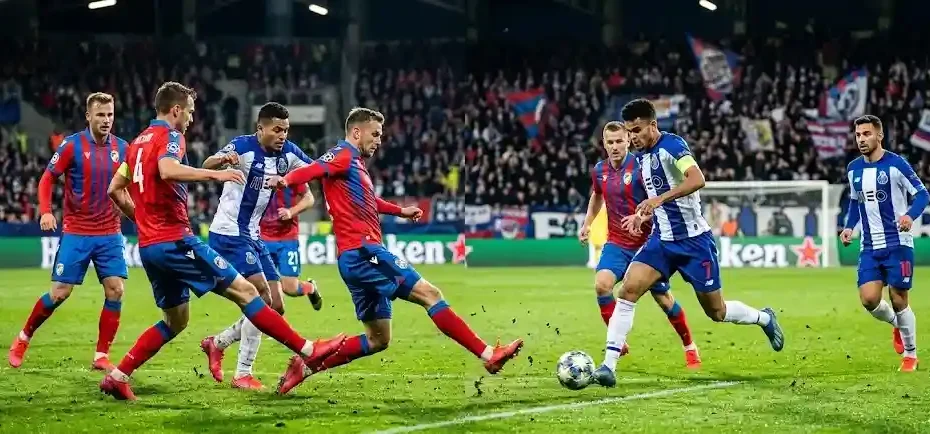 Action intense du match Viktoria Plzen Porto avec les défenseurs en rouge et bleu face aux attaquants de Porto.